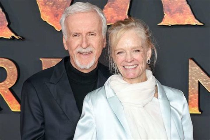 James Cameron with wife Suzy Amos and daughter and son arriving at the