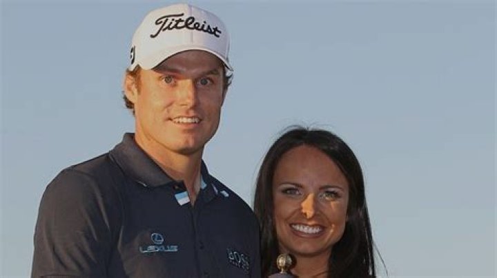 Nick Watney and wife Amber hold up the Championship Trophy after the