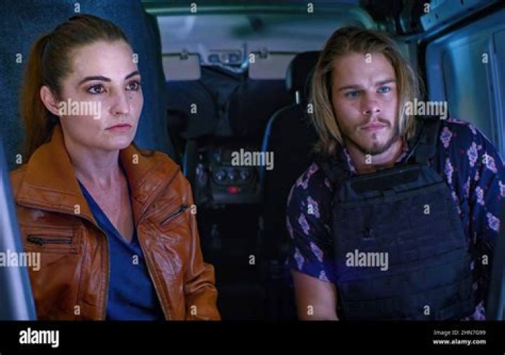 PURSUIT, from left Laurie Love, Jake Manley, 2022. © Lionsgate